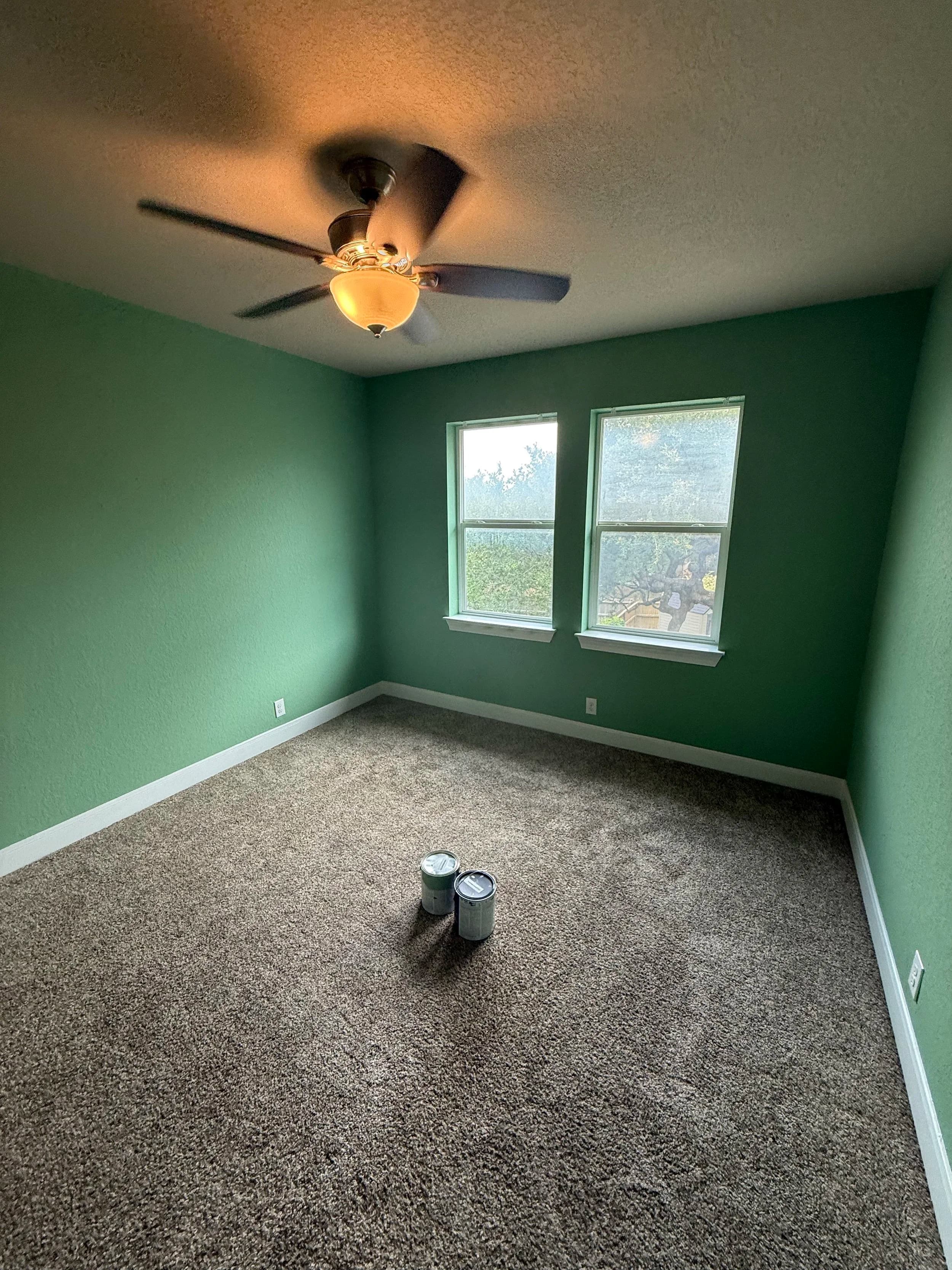 Bedroom repainted in a soft sage green