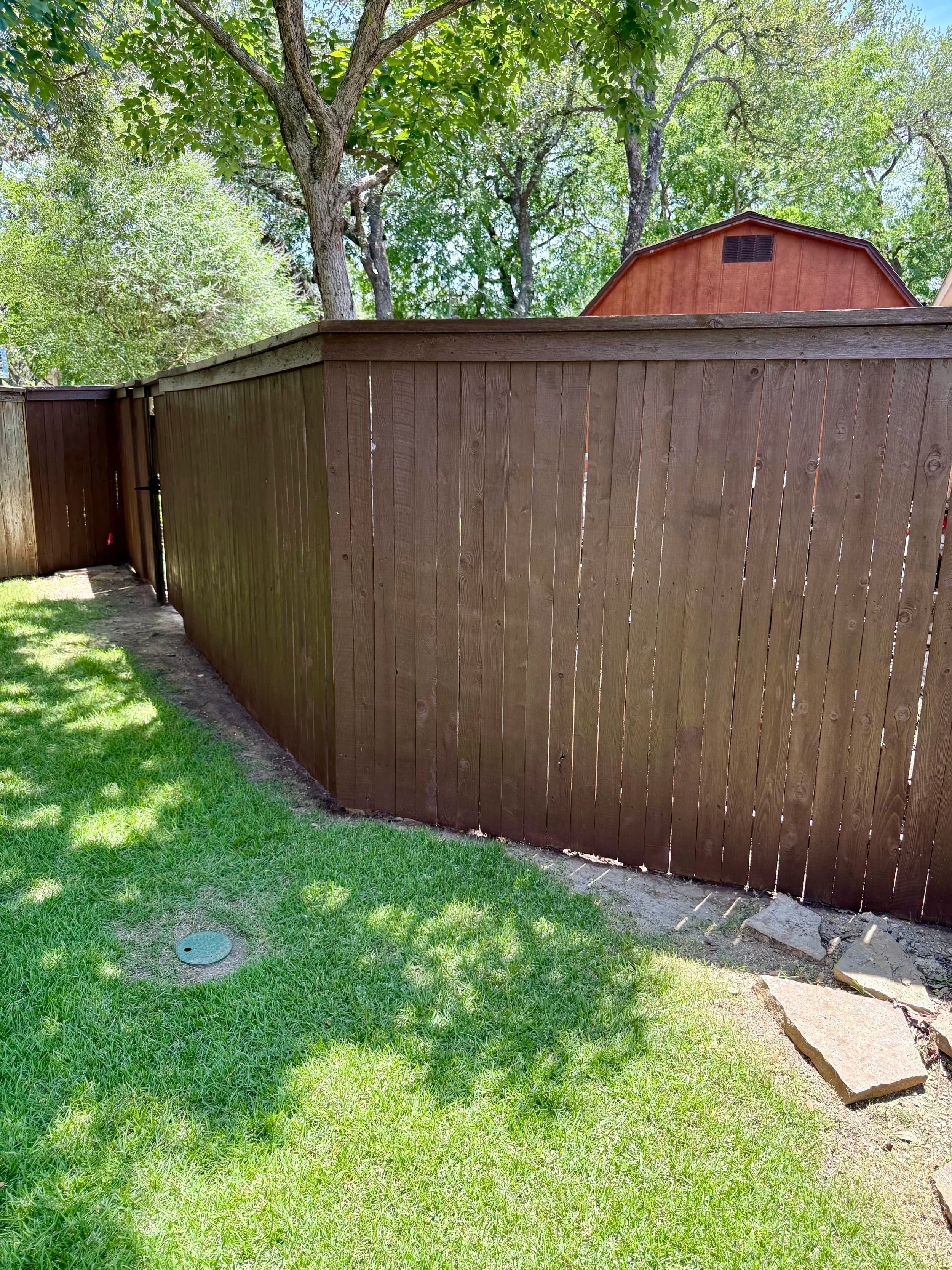 Stained wood privacy fence
