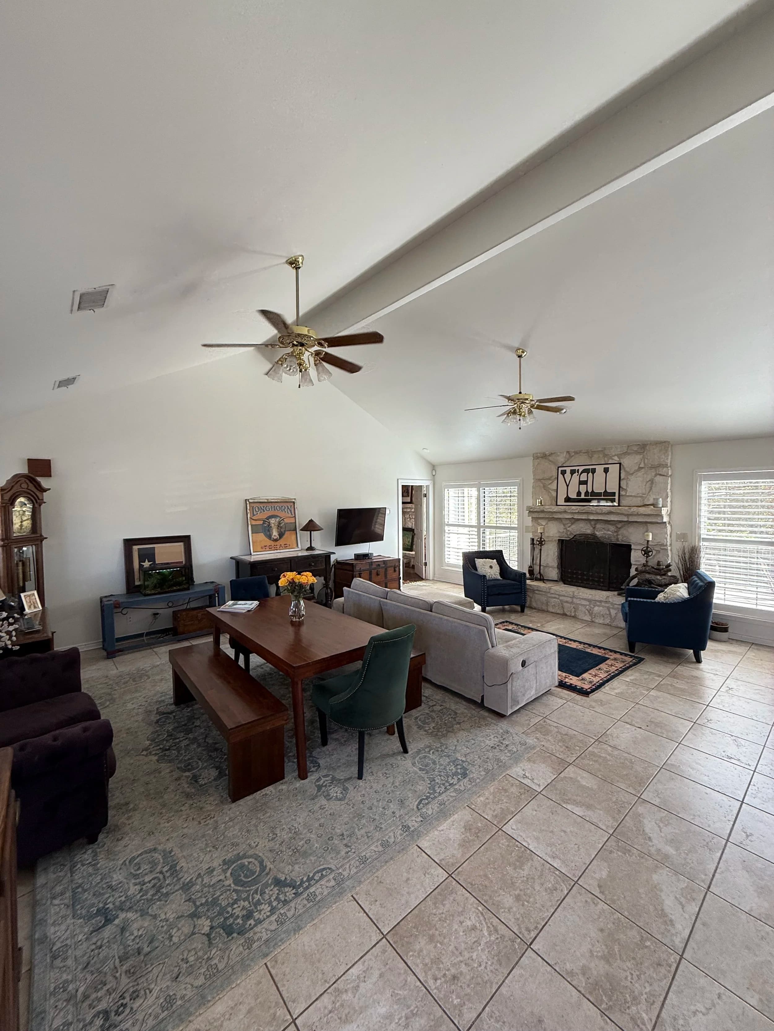 Living room with vaulted ceilings and stone fireplace